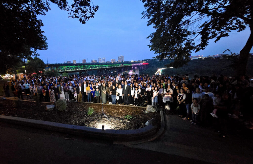High Level Bridge in Edmonton lit with green, white, red for INC’s 112th
